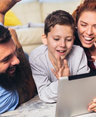 happy family watching at a device