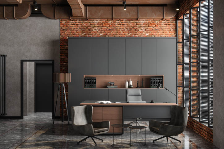 Empty CEO Office Interior With Table, Office Chairs, Cabinets And Brick Wall